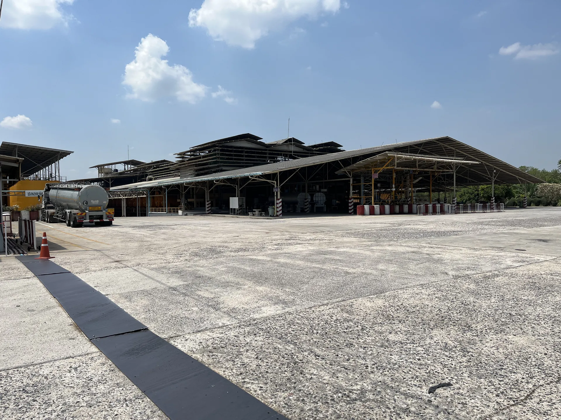 Panoramic view of the Tat Win latex processing plant and yard