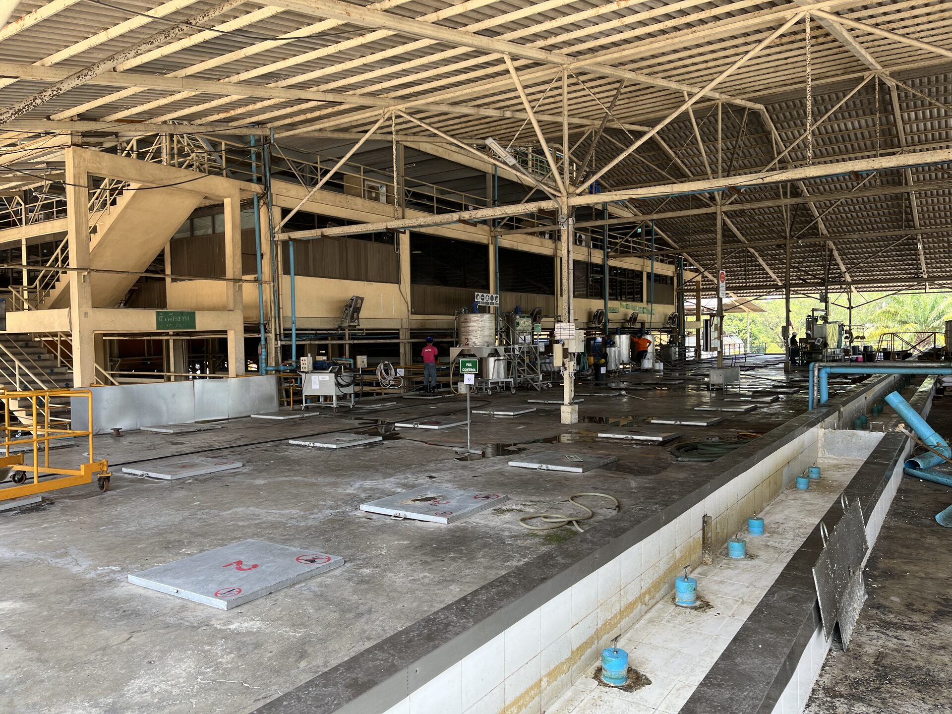 Interior of the latex process hall with mixing pits and mezzanine